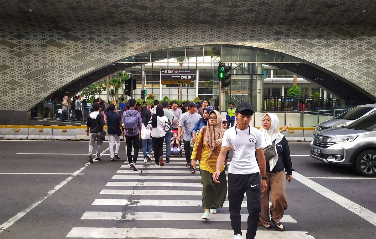 People walking on a zebra crosswalk